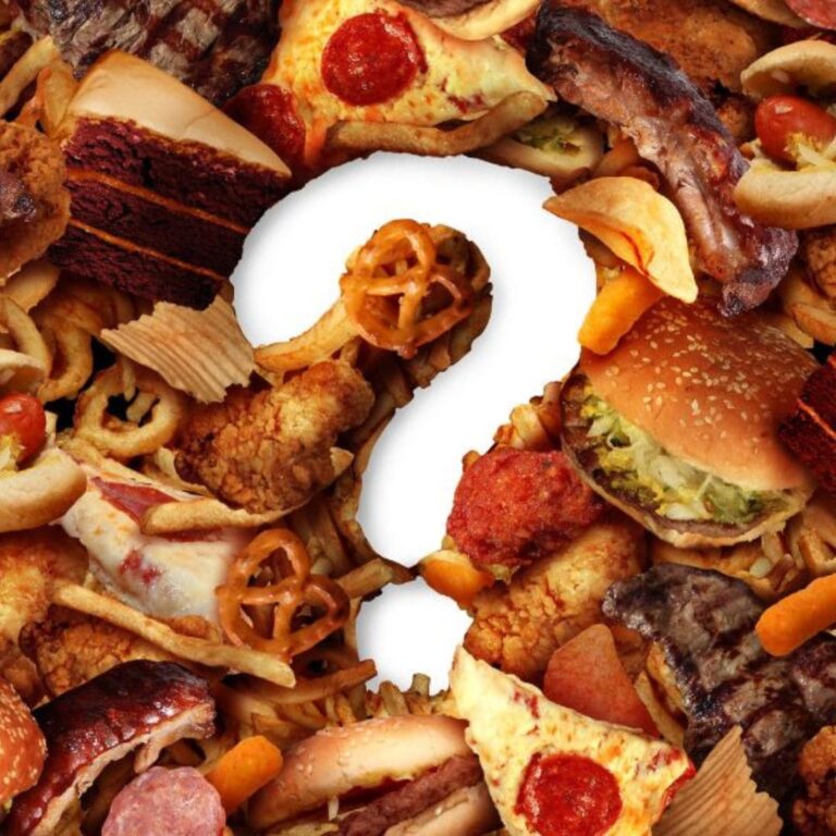 A question mark surrounded by various unhealthy fast foods like pizza, burgers, and fried snacks.